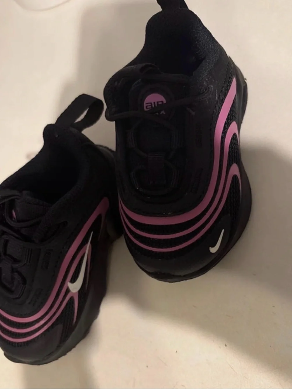 Nike Kids Black Sneakers with Pink Swoosh Accents